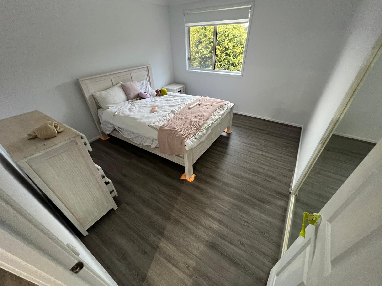 Second bedroom with new flooring laid neatly to the skirting